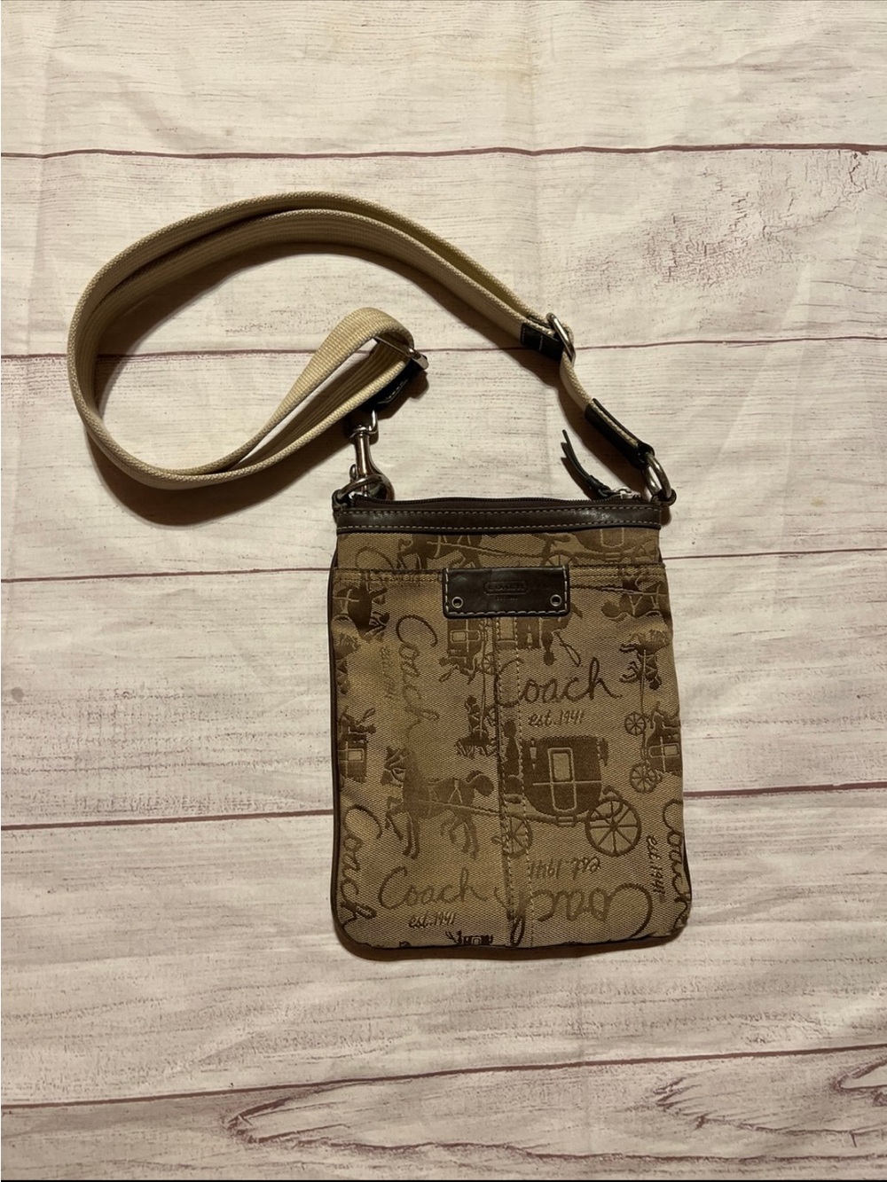 vintage Coach canvas crossbody bag in brown and tan with a horse-and-carriage